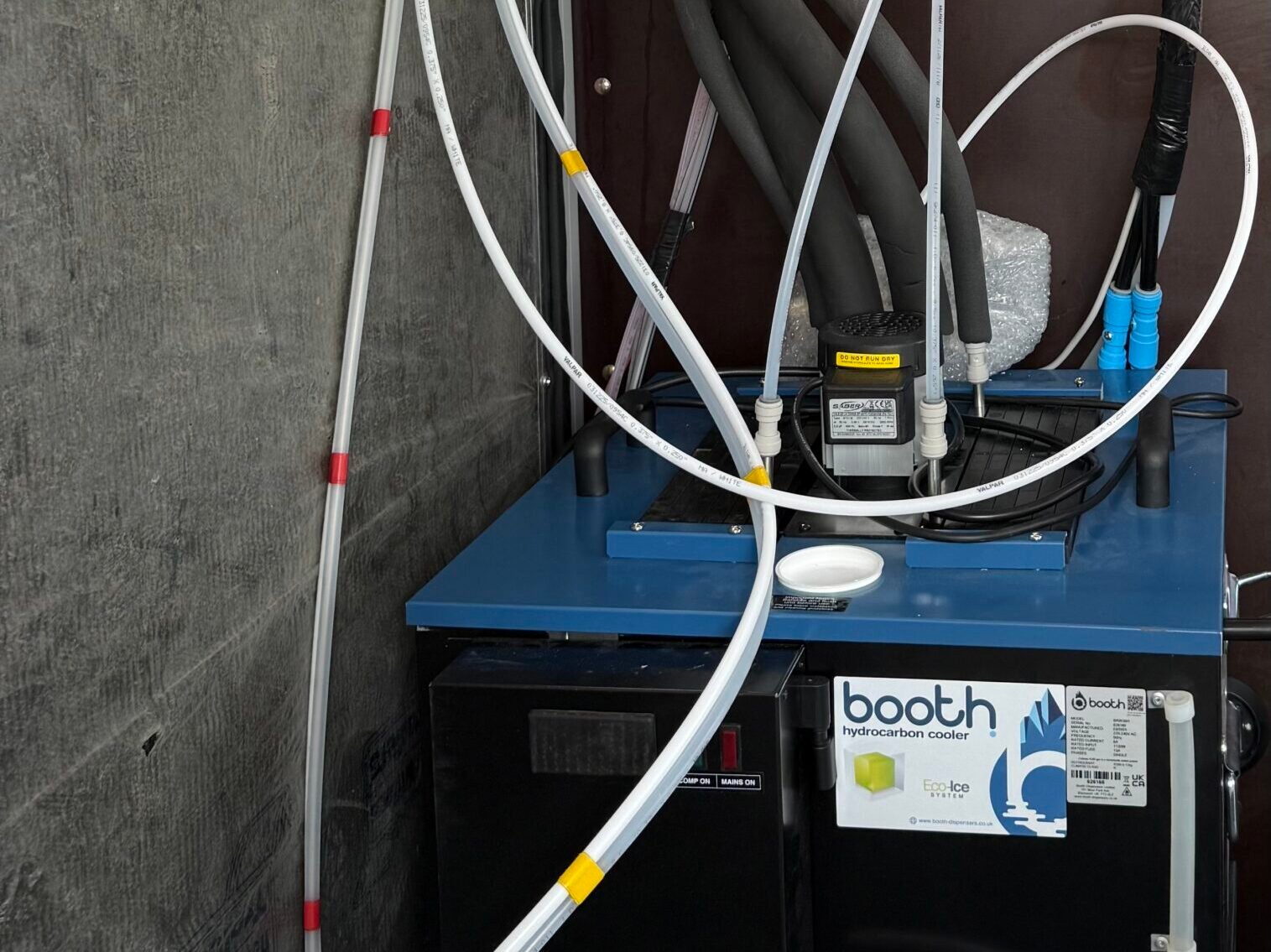 Commercial beer cooler and connected dispense lines